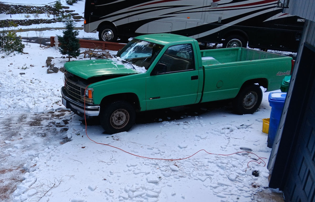 Green Truck In Snow