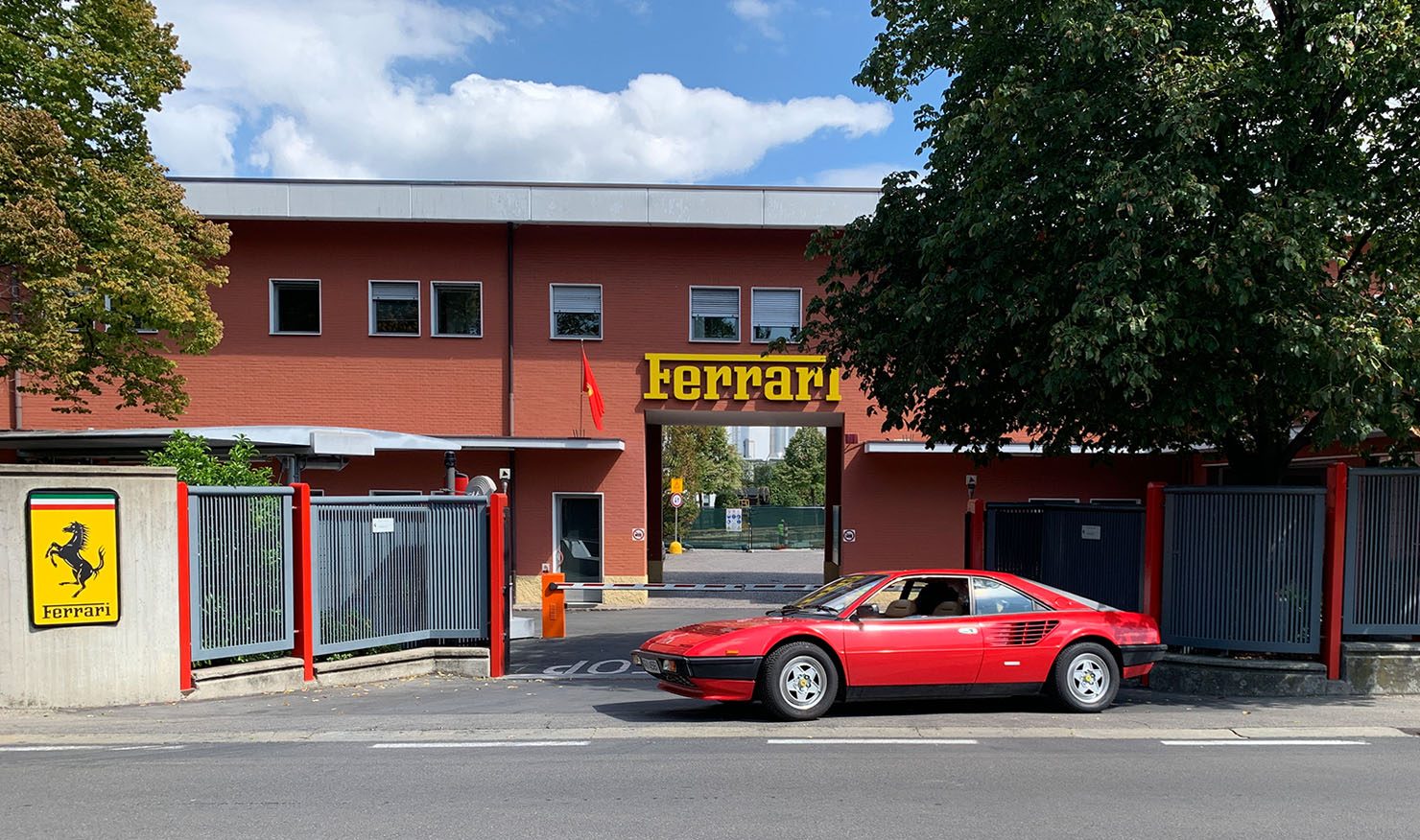 Ferrari Mondial out the gates of the Ferrari factory in Maranello